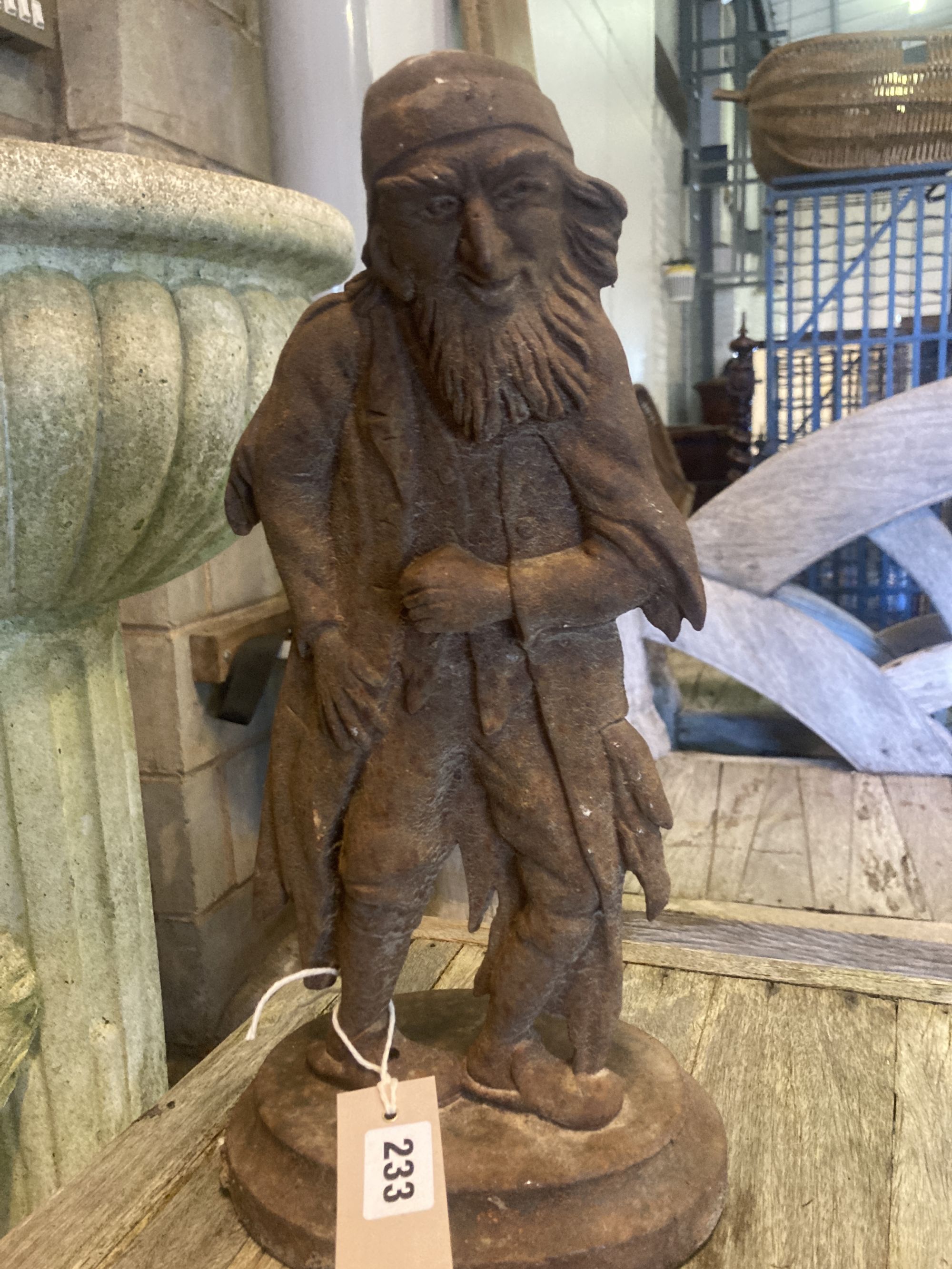 A cast iron doorstop together with a painted cast iron horse weather vase, height 50cm